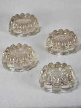 Set of four vintage French glass table risers